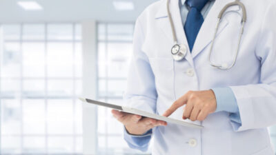 Doctor,Using,Digital,Tablet,Find,Information,Patient,Medical,History,At